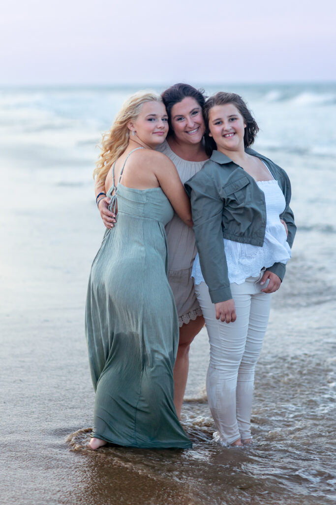 mother and daughters on the beach in virginia beach family photos by brooke tucker photography
